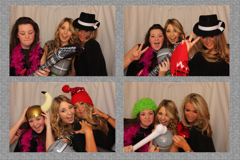 A four-photo booth strip of three friends with feather boas, a trilby and an inflatable guitar
